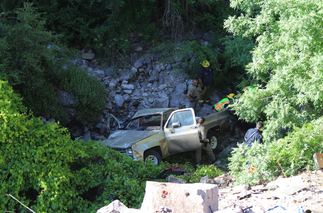 Man survives when truck goes over embankment | 12news.com