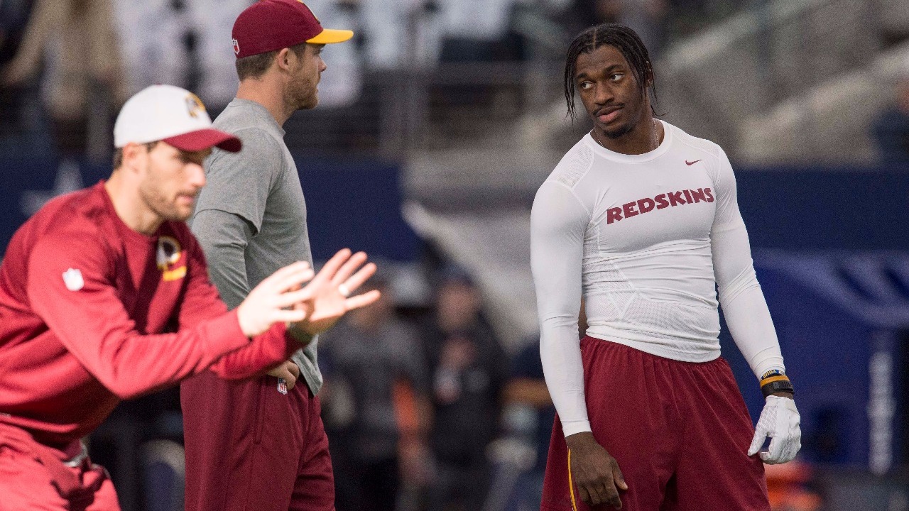 Washington Redskins quarterback Robert Griffin III (10) talks to