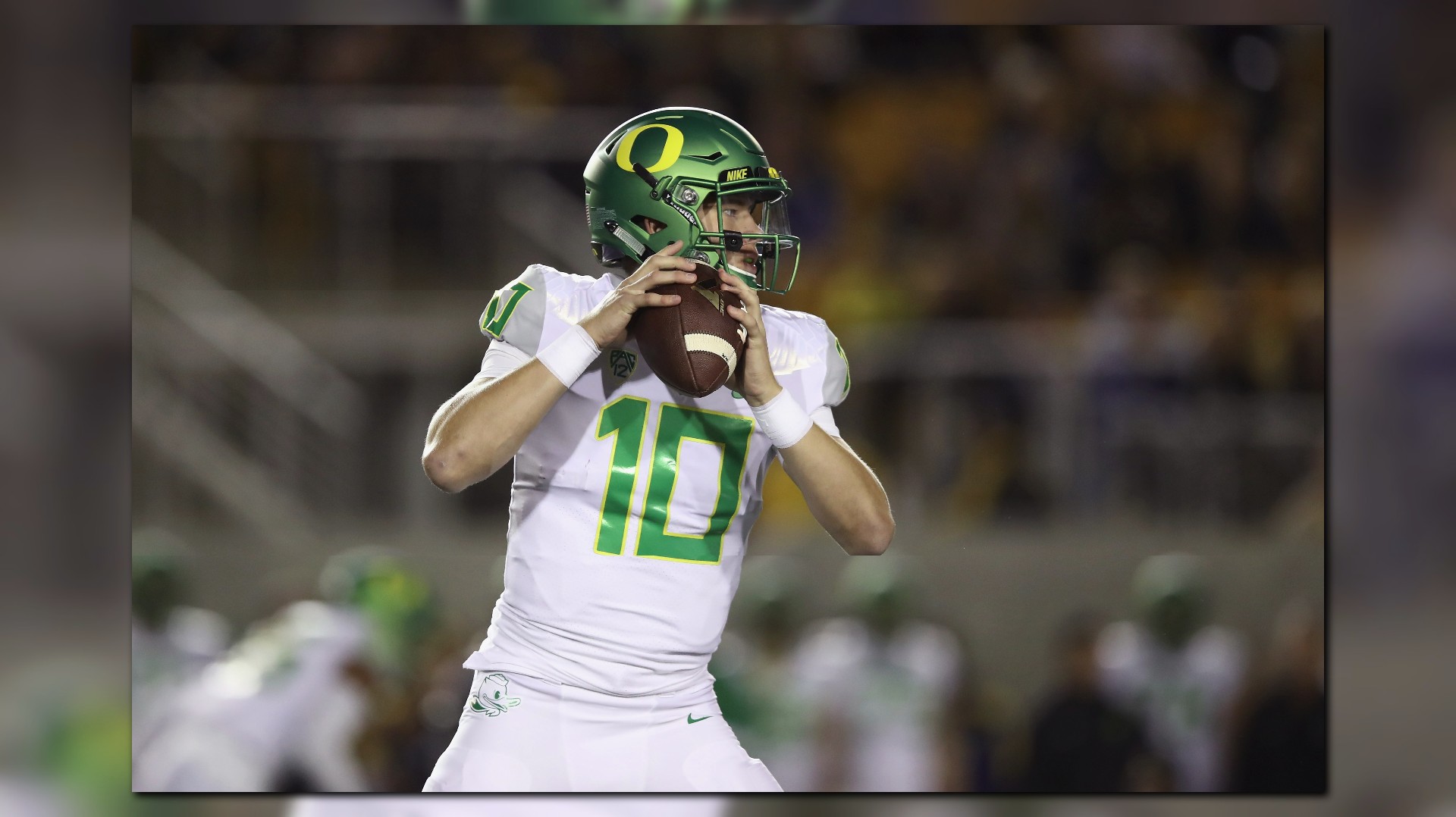 Justin Herbert of the Oregon Ducks looks to pass against the